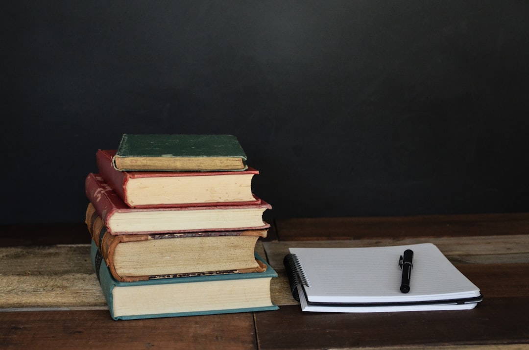 Open books on a desk, representing the classic dating books and systems in the Game Library
