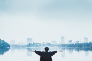 Confident man overlooking a city, illustrating male strategy, self-improvement, standards and modern manosphere themes