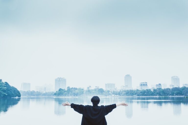 Confident man overlooking a city, illustrating male strategy, self-improvement, standards and modern manosphere themes