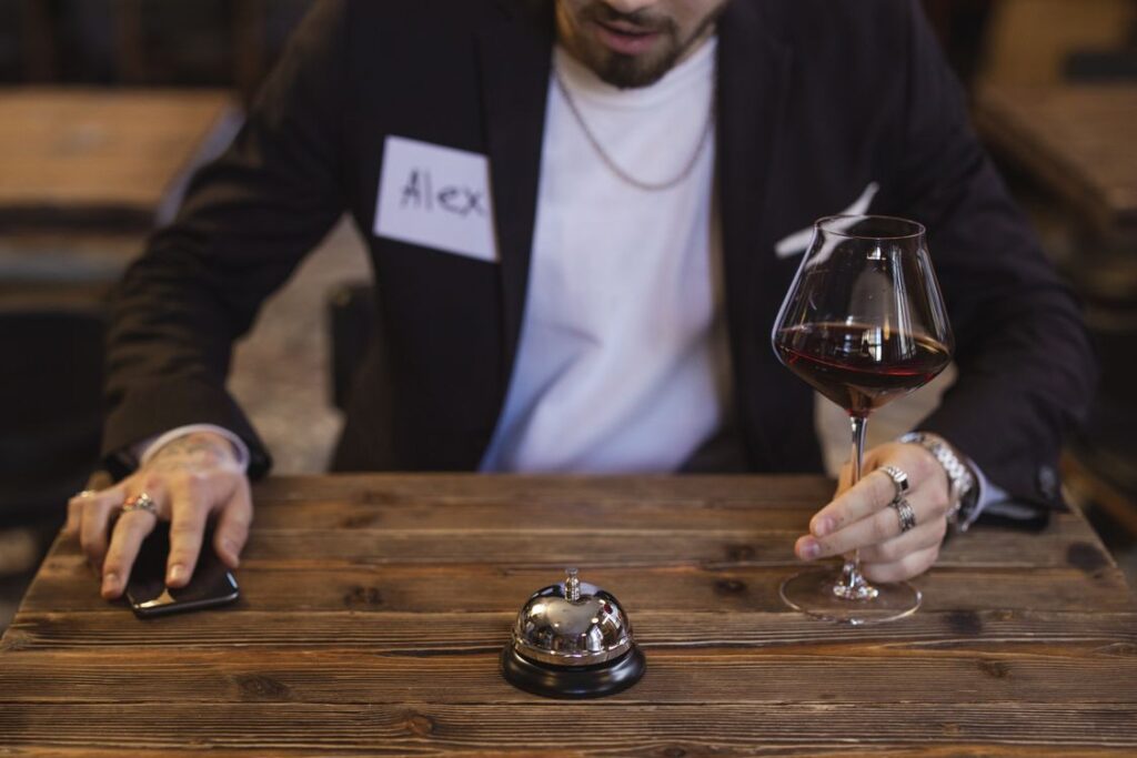 Man looking at his smartphone during a speed dating style social setting