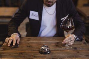 Man looking at his smartphone during a speed dating style social setting