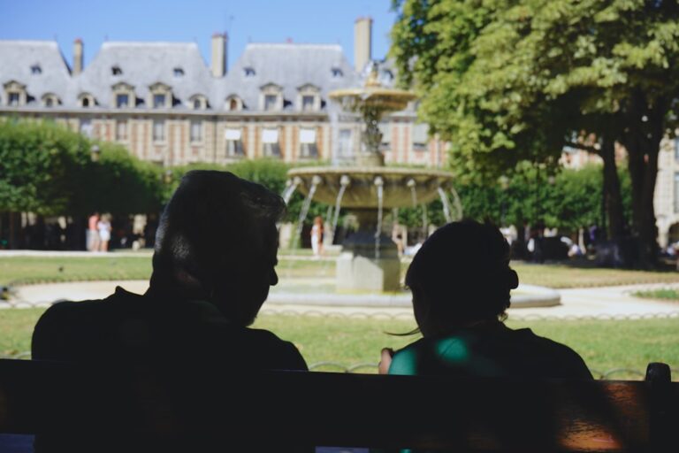 Two people talking in a public daytime setting, illustrating a respectful social approach