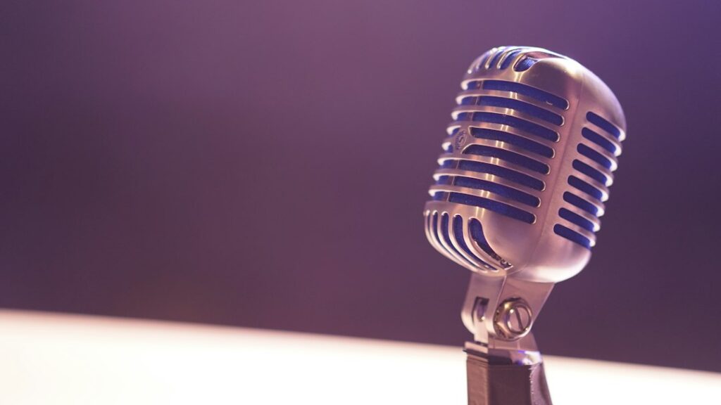 A microphone representing modern dating podcasts and creators