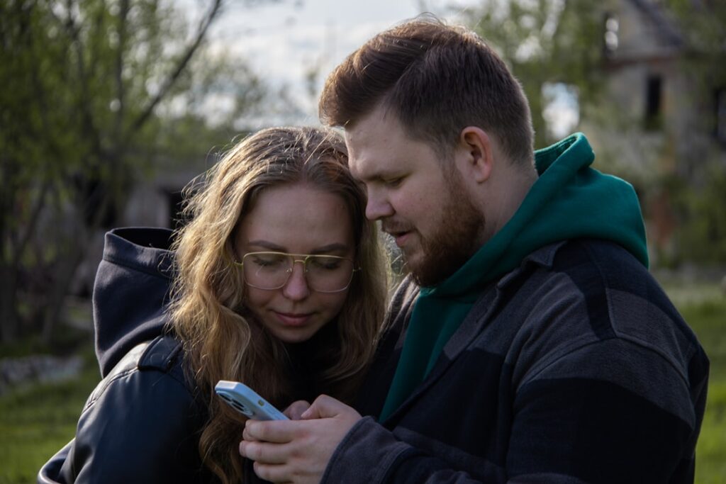 Man considering which photos to use on a dating app profile