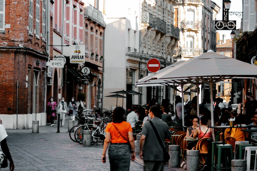 People walking through a city during the daytime