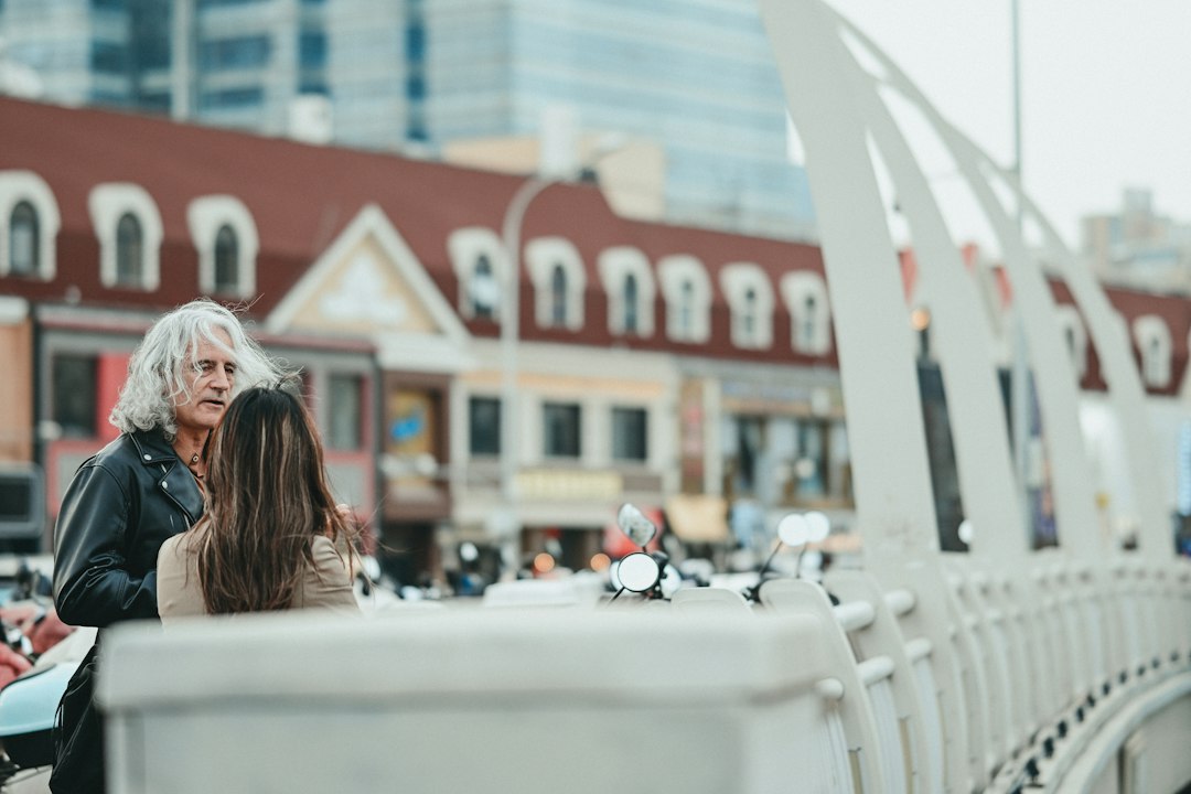 Two people talking in an urban setting
