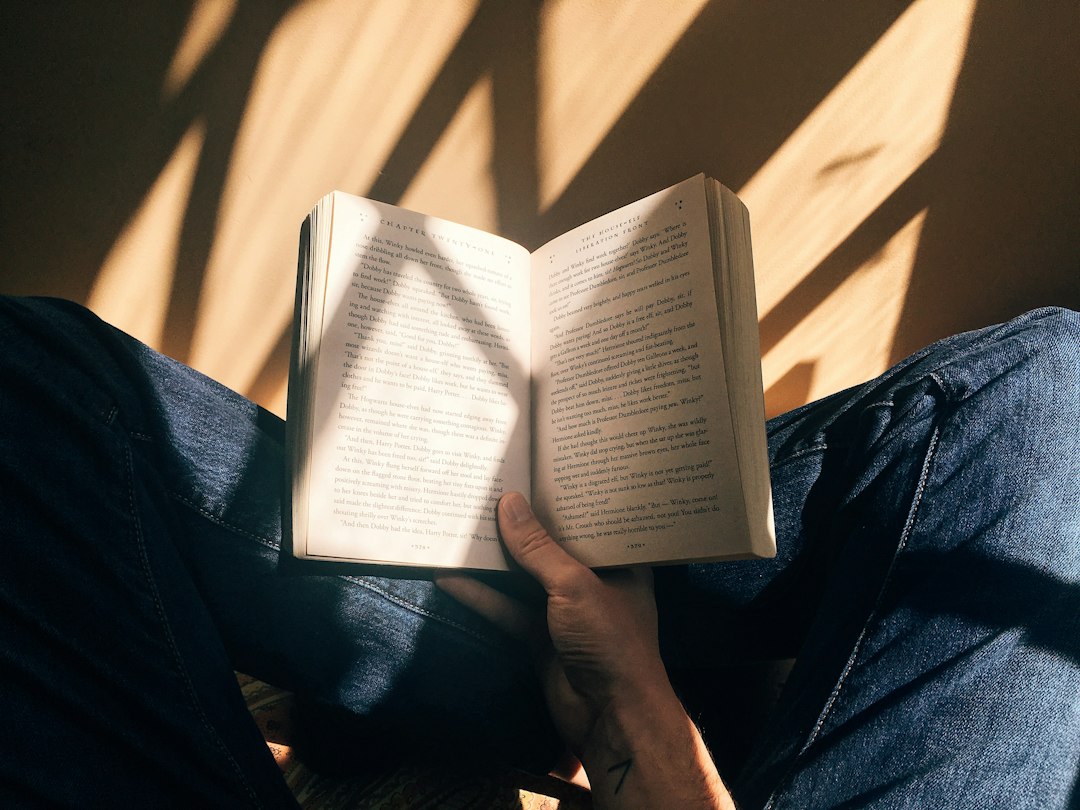 A person reading a book about personal growth