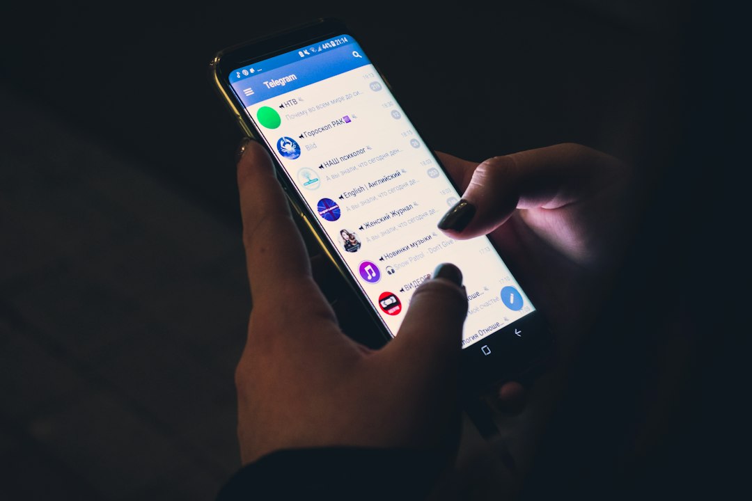 A person using a smartphone for online messaging