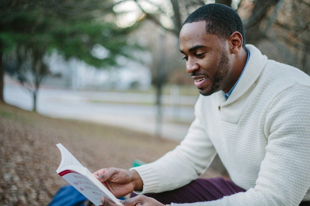 A man reading and studying outdoors