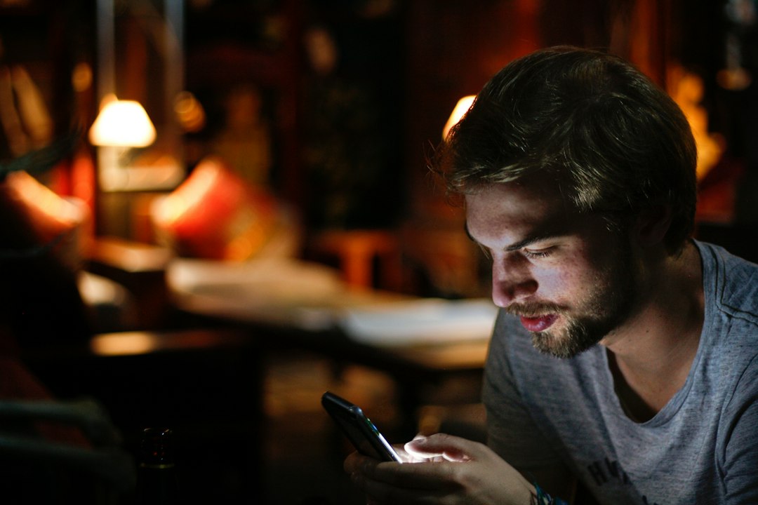 A man using a smartphone while dating online