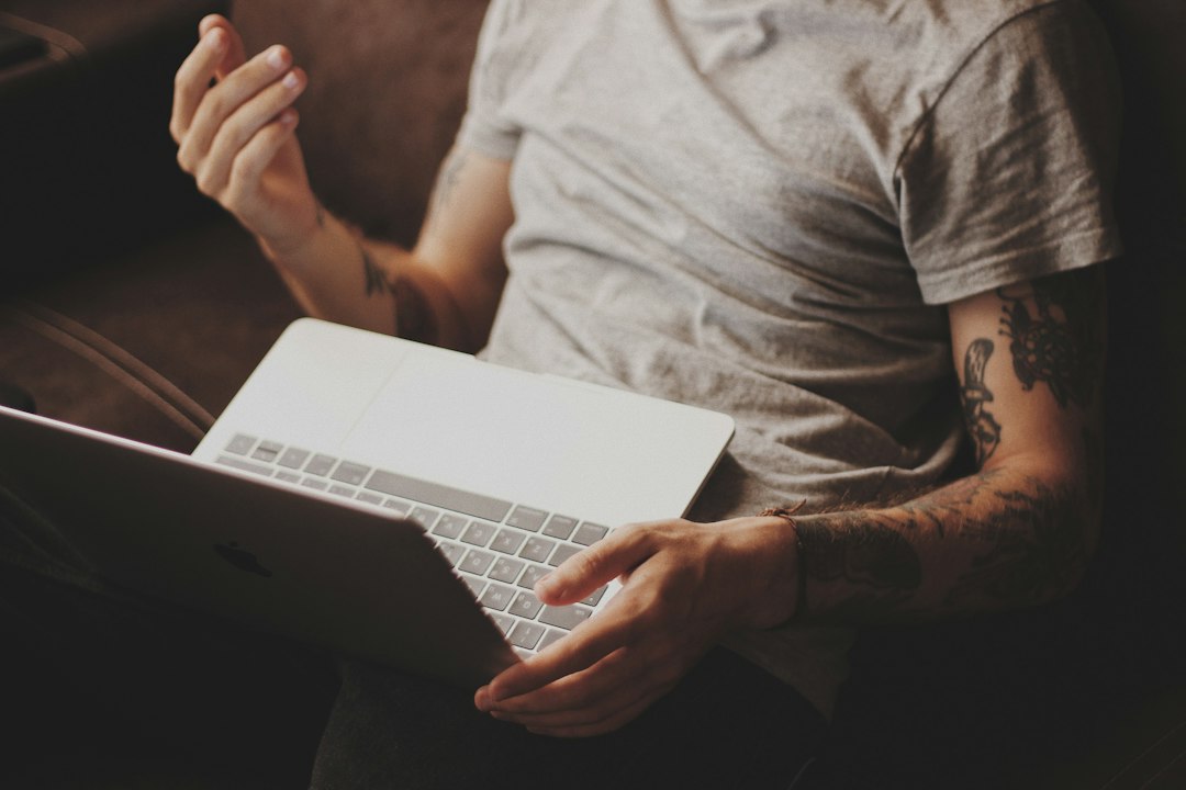 A person using a laptop for online communication