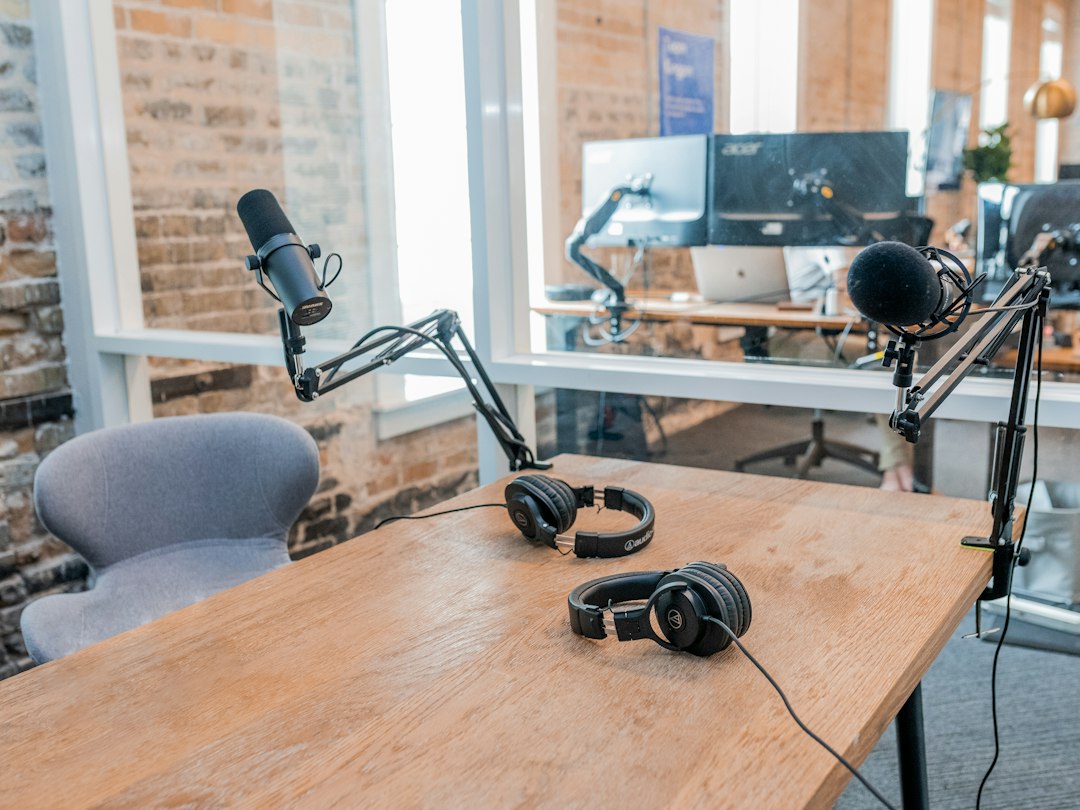 People having a recorded discussion around a table